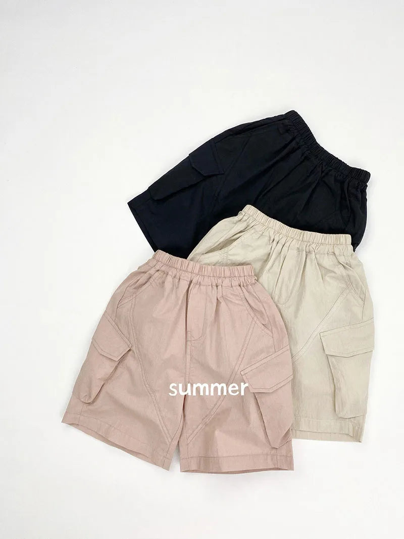 Zomer kinderoveralls schattige effen kleur zak jongens vijfkwart broek kinderen elastische taille meisjes werkkleding kort 1-6T unisex