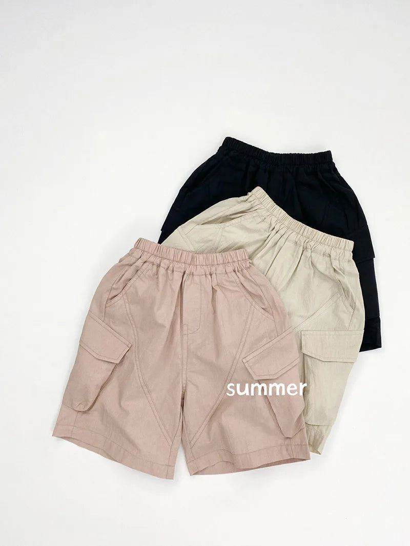 Zomer kinderoveralls schattige effen kleur zak jongens vijfkwart broek kinderen elastische taille meisjes werkkleding kort 1-6T unisex