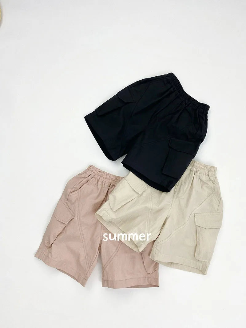 Zomer kinderoveralls schattige effen kleur zak jongens vijfkwart broek kinderen elastische taille meisjes werkkleding kort 1-6T unisex